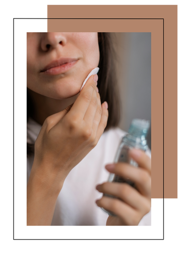 woman applying face toner to skin